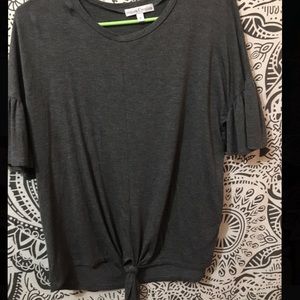 Grey top with tie bottom and bell arms